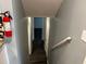 Hallway with a fire extinguisher on the wall, hardwood floors, and access to the basement at 2436 Glenrock Dr, Decatur, GA 30032