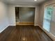 Inviting living room featuring hardwood floors, neutral paint and natural light from window at 2436 Glenrock Dr, Decatur, GA 30032