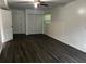 Bright living room with laminate flooring, a ceiling fan, and natural light at 2436 Glenrock Dr, Decatur, GA 30032