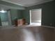 Finished basement area with carpeted floors, a wet bar, and an open doorway to another room at 4576 Creek Forestt Trl, Lilburn, GA 30047