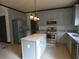 Modern kitchen featuring stainless steel appliances, granite countertops, and a center island with seating at 4576 Creek Forestt Trl, Lilburn, GA 30047