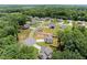 Aerial view of a neighborhood with lush greenery, offering a serene and private setting at 65 Harmony Woods Ln, Dallas, GA 30157