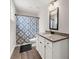 Well-lit bathroom features granite countertop vanity, a toilet, and a shower with modern fixtures at 65 Harmony Woods Ln, Dallas, GA 30157