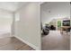 View of the bonus room from the doorway shows ample space and natural light at 65 Harmony Woods Ln, Dallas, GA 30157
