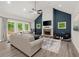 Inviting living room with vaulted ceilings, a stone fireplace, and a comfortable seating arrangement at 65 Harmony Woods Ln, Dallas, GA 30157