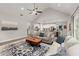 Comfortable living room with a large rug, open to the dining and kitchen areas, creating an inviting atmosphere at 65 Harmony Woods Ln, Dallas, GA 30157