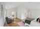 Spacious bedroom with seating area, wood floors, and ensuite bathroom at 1916 River Birch Ln, Atlanta, GA 30316