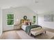 Bright bedroom with vaulted ceiling, wood floors, and large windows overlooking greenery at 1916 River Birch Ln, Atlanta, GA 30316