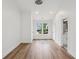 Bright bedroom with wood floors, white walls, and a view to the neighborhood at 1916 River Birch Ln, Atlanta, GA 30316