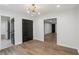 Well-lit bedroom boasts wood floors and convenient access to other rooms in the house at 1916 River Birch Ln, Atlanta, GA 30316