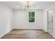 Light filled bedroom features wood floors, modern lighting and an en suite bathroom at 1916 River Birch Ln, Atlanta, GA 30316