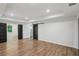Spacious bedroom with wood floors and access to the kitchen via sliding barn doors at 1916 River Birch Ln, Atlanta, GA 30316