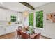 Charming dining area with modern light fixture, bright windows and stylish, comfortable seating at 1916 River Birch Ln, Atlanta, GA 30316
