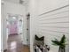 Bright entryway with white walls, shiplap accent, and view of pink front door at 1916 River Birch Ln, Atlanta, GA 30316