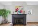 Close up of living room fireplace with mantel and shiplap accent wall at 1916 River Birch Ln, Atlanta, GA 30316