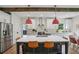 Bright kitchen featuring an island with seating, stainless appliances, and stylish pendant lighting at 1916 River Birch Ln, Atlanta, GA 30316