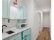 Charming kitchenette features a vintage-style refrigerator, sink and accent lighting at 1916 River Birch Ln, Atlanta, GA 30316