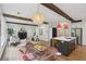 Open-concept living and dining area with hardwood floors and modern lighting at 1916 River Birch Ln, Atlanta, GA 30316