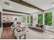 Bright living room boasts large windows offering a view of lush greenery and an open floor plan at 1916 River Birch Ln, Atlanta, GA 30316