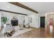 Spacious living room with hardwood floors, fireplace, and exposed beams at 1916 River Birch Ln, Atlanta, GA 30316