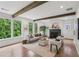 Bright living room featuring hardwood floors, a fireplace, and large windows at 1916 River Birch Ln, Atlanta, GA 30316