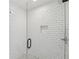 Modern shower with glass door, subway tile, and built-in niche at 1916 River Birch Ln, Atlanta, GA 30316