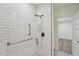 Modern shower featuring subway tile, grab bars, and sleek fixtures at 1916 River Birch Ln, Atlanta, GA 30316