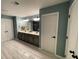 Spacious bathroom with a double sink vanity, walk-in shower, and a double door linen closet at 2030 Hydrangea Ln, Austell, GA 30106