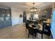 Well-lit kitchen with stainless steel appliances, gray cabinets, and a dining area for casual meals at 2030 Hydrangea Ln, Austell, GA 30106