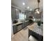 Modern kitchen features stainless steel appliances, granite countertops, and gray cabinets with ample storage at 2030 Hydrangea Ln, Austell, GA 30106