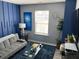 Bright living room featuring trendy furniture, statement wall, and abundant natural light at 2030 Hydrangea Ln, Austell, GA 30106