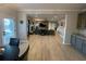 An open-concept floor plan with the kitchen flowing into the living room, featuring a fireplace and TV at 2030 Hydrangea Ln, Austell, GA 30106