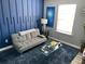 Comfortable living room with stylish decor, plush rug, and ample natural light at 2030 Hydrangea Ln, Austell, GA 30106