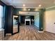An open-concept living room leading to the primary bedroom, complete with a fireplace at 2030 Hydrangea Ln, Austell, GA 30106
