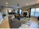 Bright living room featuring a fireplace, large windows, and a sectional sofa, perfect for relaxation and entertaining at 2030 Hydrangea Ln, Austell, GA 30106
