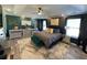 A beautifully decorated primary bedroom showcasing a trey ceiling and modern furnishings at 2030 Hydrangea Ln, Austell, GA 30106