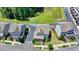 Aerial view showcasing the beautiful homes in a quiet neighborhood with manicured lawns at 3621 Portland Trail Dr, Suwanee, GA 30024