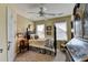Traditional bedroom with a decorative bedframe, detailed dresser, and a ceiling fan at 3621 Portland Trail Dr, Suwanee, GA 30024