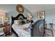 Charming bedroom showcasing a decorative bedframe, unique artwork, and stylish furnishings at 3621 Portland Trail Dr, Suwanee, GA 30024