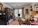 Bright room featuring a window, writing desk, and clothing rack at 3621 Portland Trail Dr, Suwanee, GA 30024