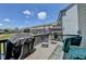 A deck featuring outdoor seating with a grill and a view of the neighborhood at 3621 Portland Trail Dr, Suwanee, GA 30024