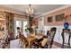 Comfortable dining area with seating for six, decorative accents, and lots of natural light at 3621 Portland Trail Dr, Suwanee, GA 30024