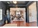 Elegant dining room featuring hardwood floors, a chandelier, and an open doorway, creating an inviting atmosphere at 3621 Portland Trail Dr, Suwanee, GA 30024