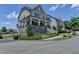 Charming two-story home with stone accents, a welcoming front porch, and manicured landscaping at 3621 Portland Trail Dr, Suwanee, GA 30024