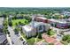 Exterior shot of a City Hall building with a clock tower, surrounded by trees, landscaping, and parking areas at 3621 Portland Trail Dr, Suwanee, GA 30024