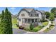 Beautiful two-story home with a stone facade, inviting front porch, and lush landscaping at 3621 Portland Trail Dr, Suwanee, GA 30024