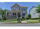 Charming two-story home features a welcoming front porch with stone accents and a well-manicured lawn at 3621 Portland Trail Dr, Suwanee, GA 30024