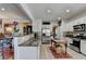 Spacious kitchen with modern appliances, granite countertops and open layout to the living area at 3621 Portland Trail Dr, Suwanee, GA 30024