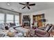 Cozy living room with a fireplace, comfortable seating, and a stylish decor and view to the yard at 3621 Portland Trail Dr, Suwanee, GA 30024