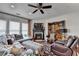 Comfortable living area with a fireplace, TV, and lots of natural light at 3621 Portland Trail Dr, Suwanee, GA 30024